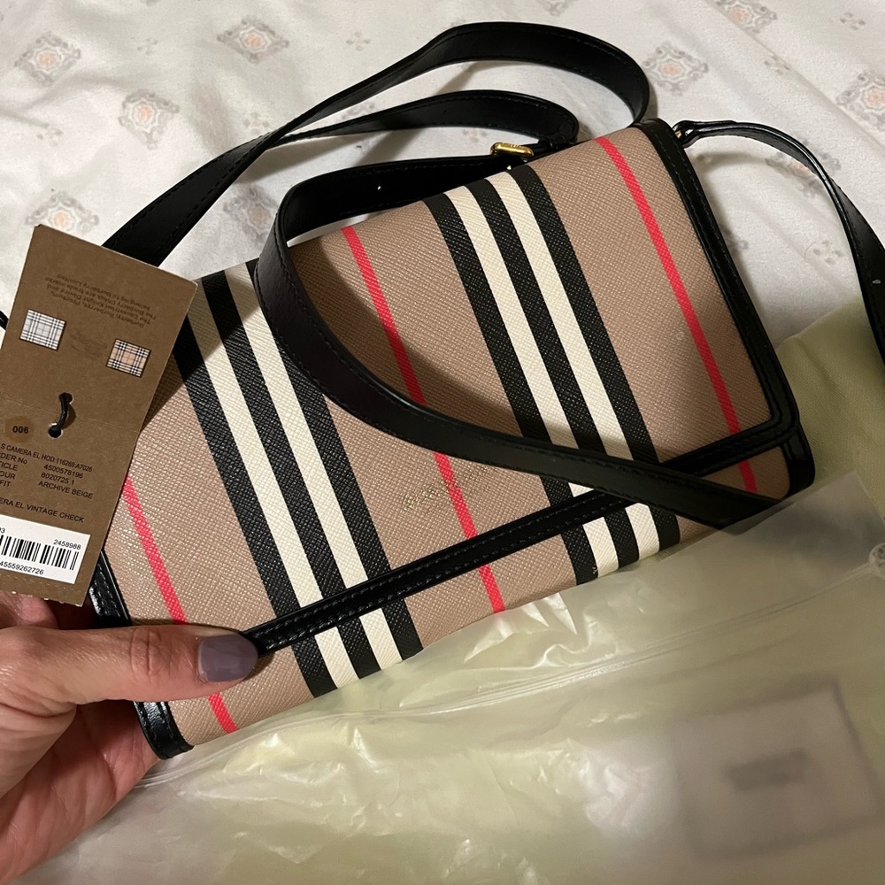 It’s a really cute Burberry purse brand new never used it with tags
